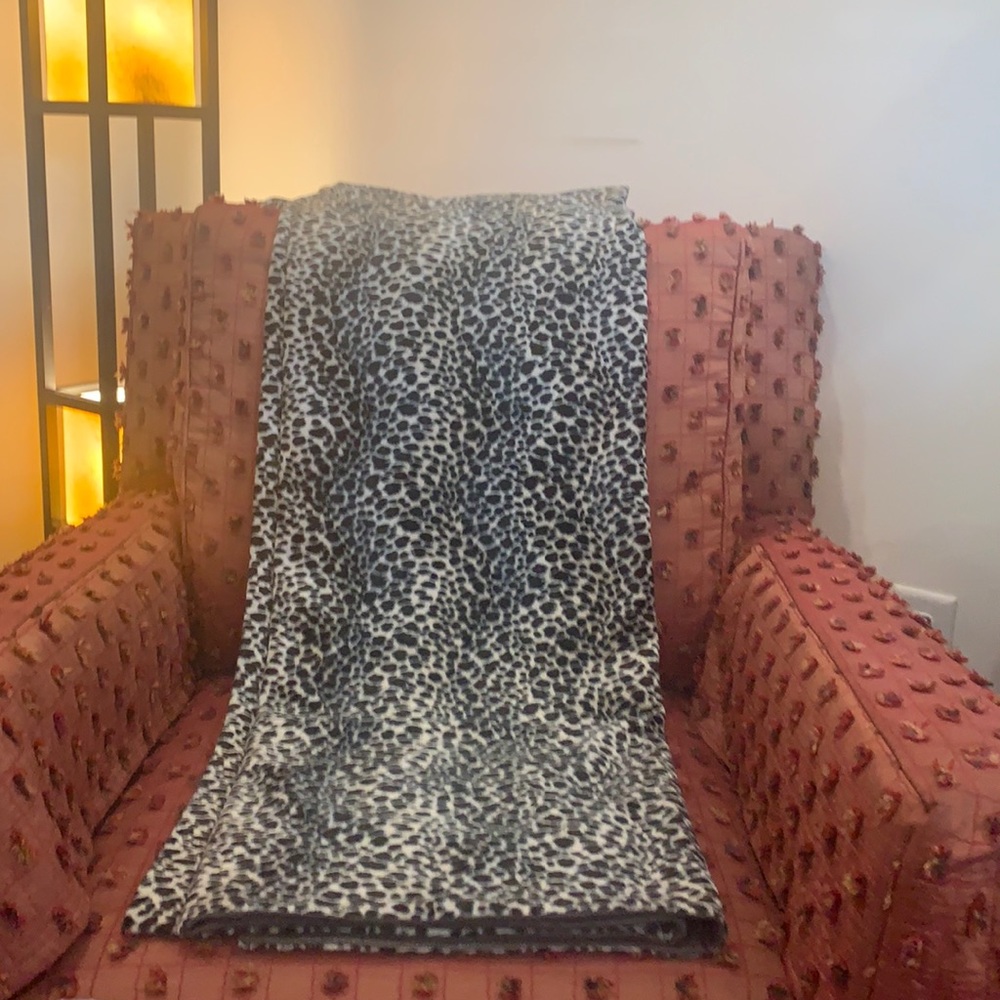 Snow leopard Throw -soft animal print fabric with leather look lining.